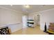 Open living space with tile flooring, wainscoting detail, and an aquarium on a stand at 310 Willow Ln, Temple, GA 30179