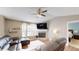 Cozy living room featuring a fireplace, large windows, and comfortable seating at 310 Willow Ln, Temple, GA 30179