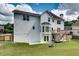 A well maintained yard is shown with walkout basement, deck and fence at 1226 Kelly Nelson Ct, Lawrenceville, GA 30043