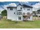 Spacious backyard with fire pit, deck, patio and walkout basement, ideal for outdoor enjoyment and activities at 1226 Kelly Nelson Ct, Lawrenceville, GA 30043