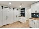 Finished basement featuring custom cabinets, sink, shelving, and storage at 1226 Kelly Nelson Ct, Lawrenceville, GA 30043
