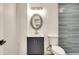 Charming bathroom with updated vanity, mirror, and stylish tile at 1226 Kelly Nelson Ct, Lawrenceville, GA 30043