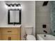 Modern bathroom with a vanity and a tiled shower-bath with a black rainfall shower at 1226 Kelly Nelson Ct, Lawrenceville, GA 30043