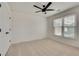 Well-lit bedroom with plush carpet, ceiling fan, and a double closet at 1226 Kelly Nelson Ct, Lawrenceville, GA 30043