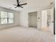 This spacious bedroom has carpet floors, a ceiling fan, and a closet at 1226 Kelly Nelson Ct, Lawrenceville, GA 30043