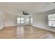 A bonus room with wide-plank floors and lots of natural light from the windows at 1226 Kelly Nelson Ct, Lawrenceville, GA 30043