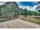 Spacious wooden deck perfect for entertaining, overlooking the backyard, offering outdoor living at 1226 Kelly Nelson Ct, Lawrenceville, GA 30043