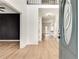 Spacious foyer featuring light hardwood floors and a striking dark accent wall at 1226 Kelly Nelson Ct, Lawrenceville, GA 30043