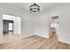Bright room with light hardwood floors, white walls and doorway into foyer at 1226 Kelly Nelson Ct, Lawrenceville, GA 30043