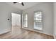 Bright room with light hardwood floors, white walls, and large windows at 1226 Kelly Nelson Ct, Lawrenceville, GA 30043
