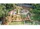 Aerial view of backyard with terraced landscaping, stone waterfall, and fire pit at 1691 Houghton N Ct, Atlanta, GA 30338