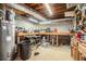 Unfinished basement workshop area with cinder block walls and exposed ductwork at 1691 Houghton N Ct, Atlanta, GA 30338