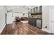 Basement with wood floors, wet bar with backsplash and mini refrigerator, and seating area at 1691 Houghton N Ct, Atlanta, GA 30338