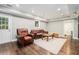 Finished basement with recessed lighting, exterior door, and comfortable seating area at 1691 Houghton N Ct, Atlanta, GA 30338