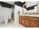 Elegant bathroom features dark accent wall, granite vanity, and glass-enclosed shower at 1691 Houghton N Ct, Atlanta, GA 30338