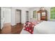 Bedroom with closet, hardwood floors, and ample sunlight from large windows at 1691 Houghton N Ct, Atlanta, GA 30338