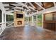 Cozy covered patio with a stone fireplace, ceiling fan, and wood accents at 1691 Houghton N Ct, Atlanta, GA 30338