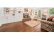 Inviting living room with a brick fireplace, built-in shelving, and hardwood floors at 1691 Houghton N Ct, Atlanta, GA 30338