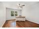 Bright office space features hardwood floors, neutral paint, and a large window at 1691 Houghton N Ct, Atlanta, GA 30338