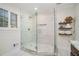 Modern bathroom features a large glass shower with tile surround and built-in shelving at 1691 Houghton N Ct, Atlanta, GA 30338