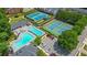 Aerial view showcases the pool and tennis courts, offering resort-style recreation at 3401 Village Green Dr, Roswell, GA 30075