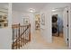 Upstairs hallway boasts custom built-in shelves, modern lighting, and convenient access to the laundry room at 3401 Village Green Dr, Roswell, GA 30075