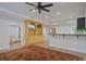 Basement living room with a built-in entertainment center, bar seating, and a neutral color palette at 3401 Village Green Dr, Roswell, GA 30075