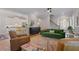 Open concept living area showcasing hardwood floors, neutral paint, and an inviting flow to the kitchen at 3401 Village Green Dr, Roswell, GA 30075