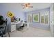 Home office features large windows, neutral carpeting, and a white desk at 3401 Village Green Dr, Roswell, GA 30075