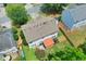 Aerial view of home with lush green backyard with patio, fenced in yard and mature trees at 508 Keeneland Ave, Woodstock, GA 30189