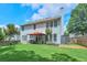Expansive backyard with a well-maintained lawn, complemented by a cozy patio with gazebo for relaxation and outdoor enjoyment at 508 Keeneland Ave, Woodstock, GA 30189
