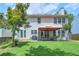 Spacious backyard featuring a patio area with an orange gazebo and lush green lawn, perfect for outdoor entertaining at 508 Keeneland Ave, Woodstock, GA 30189