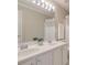 Bathroom with double sink vanity, white cabinets, and neutral color walls at 508 Keeneland Ave, Woodstock, GA 30189