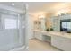 Bathroom with a glass-enclosed shower, double vanity, and neutral color scheme at 508 Keeneland Ave, Woodstock, GA 30189
