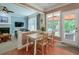 Bright dining area with hardwood floors, views of the backyard and access to the outdoor living area at 508 Keeneland Ave, Woodstock, GA 30189