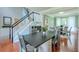 Dining area adjacent to stairs, table for desk area, and second dining area at 508 Keeneland Ave, Woodstock, GA 30189