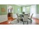 Dining room with green walls and wainscoting and rug under the table at 508 Keeneland Ave, Woodstock, GA 30189