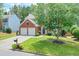 Charming two-story brick home with a well-maintained front yard and two-car garage at 508 Keeneland Ave, Woodstock, GA 30189