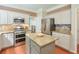 Modern kitchen with stainless steel appliances, granite countertops, and island at 508 Keeneland Ave, Woodstock, GA 30189