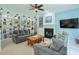 Inviting living room with built-in bookshelves, a fireplace, and comfortable seating at 508 Keeneland Ave, Woodstock, GA 30189