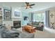 Comfortable living room features a fireplace, large windows, and plush seating at 508 Keeneland Ave, Woodstock, GA 30189