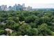 A beautiful property with lush greenery and mature trees, with the city in the background at 348 7Th Ne St, Atlanta, GA 30308