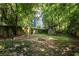 A lovely backyard with mature trees, fire pit, and lots of space at 348 7Th Ne St, Atlanta, GA 30308