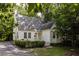 Charming cottage-style home with mature trees and a well-maintained yard provides great curb appeal at 348 7Th Ne St, Atlanta, GA 30308