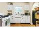 Functional kitchen featuring vintage cabinetry, stainless steel appliances, ample counter space, and hardwood floors at 348 7Th Ne St, Atlanta, GA 30308