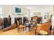 Sunlit living area with hardwood floors, cozy fireplace, comfortable seating, and ample natural light at 348 7Th Ne St, Atlanta, GA 30308