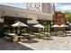 Outdoor dining area with tables and umbrellas at Trader Joe's at 348 7Th Ne St, Atlanta, GA 30308
