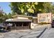 Quaint restaurant Woody's, featuring outdoor seating, a vintage sign, and local charm at 348 7Th Ne St, Atlanta, GA 30308