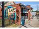 Exterior shot of The Lucky Exchange shop with artistic mural and storefront at 348 7Th Ne St, Atlanta, GA 30308