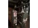 Basement mechanicals featuring a hot water tank and furnace, providing essential home systems at 4819 Coppedge Trl, Peachtree Corners, GA 30096
